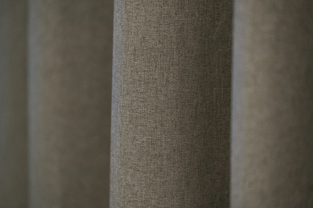 Beige heavyweight blackout curtain panels in calm bedroom — Decoee Australia
