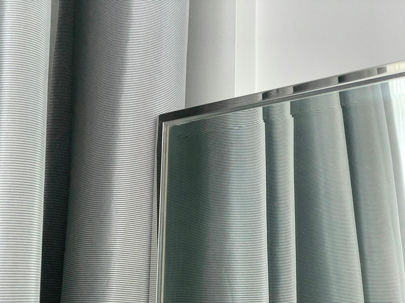 Grey heavyweight blackout curtains installed in bedroom no-drill — Decoee Australia