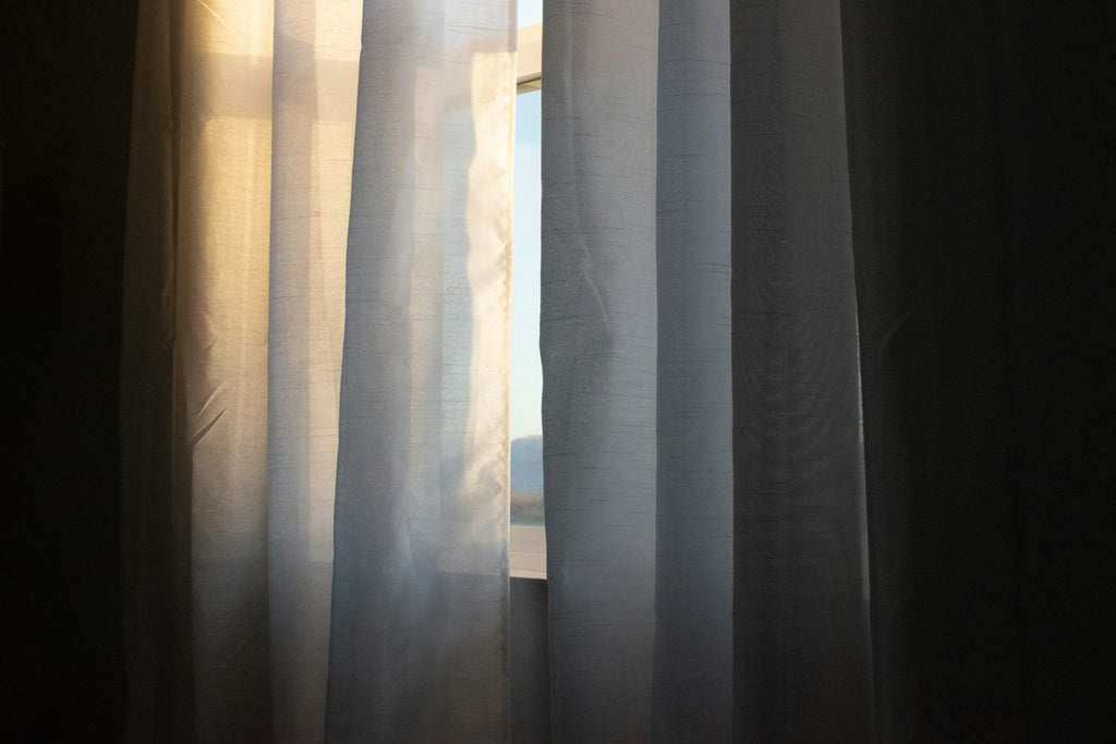 Heavyweight blackout curtains layered with sheer for daytime privacy — Decoee Australia
